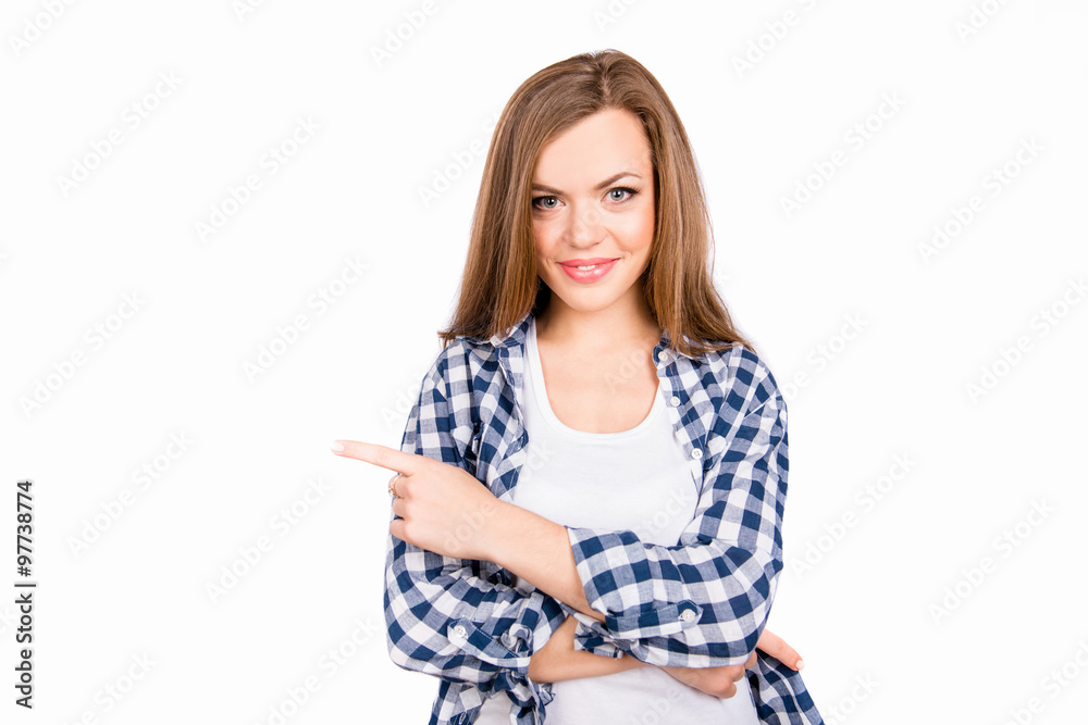 beautiful girl in a tartan shirt points toward the finger beautiful girl in a tartan shirt points toward the finger