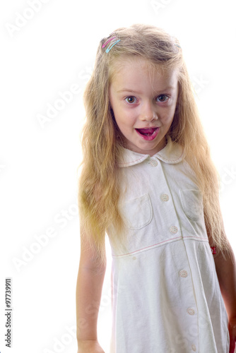 Young blonde little girl in white