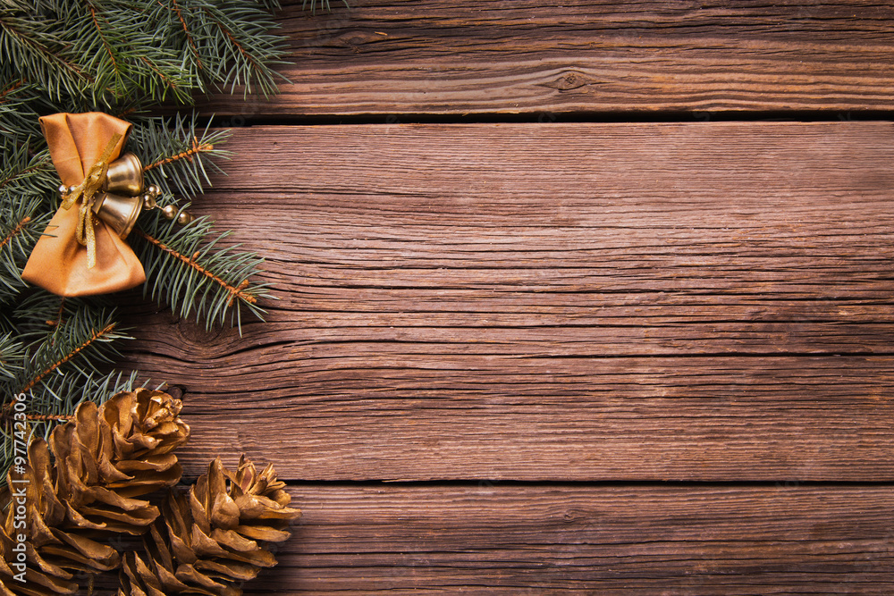 Fototapeta premium Christmas decoration with pine on a wooden table, as a background