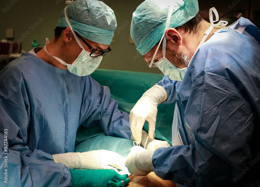 Couple of Surgeon at work in operating room. Couple of Surgeon at work in operating room.