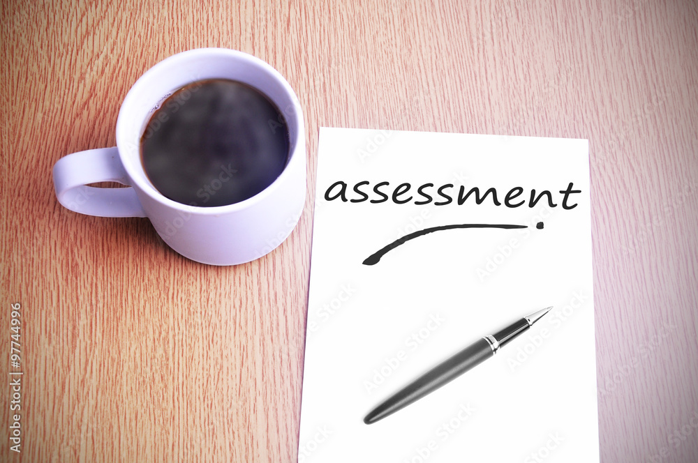 Coffee on the table with note writing assessment Coffee on the table with note writing assessment