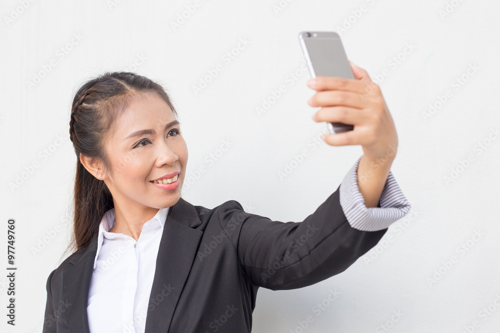 Business woman holding cellphone. checking email text messaging Business woman holding cellphone. checking email text messaging