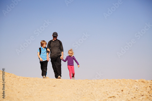 father traveling with two kids