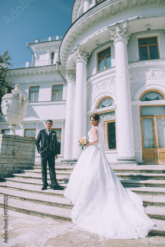 Groom and bride near Wedding palace