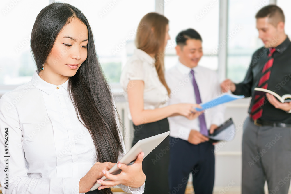 Successful asian business woman holding tablet PC Successful asian business woman holding tablet PC