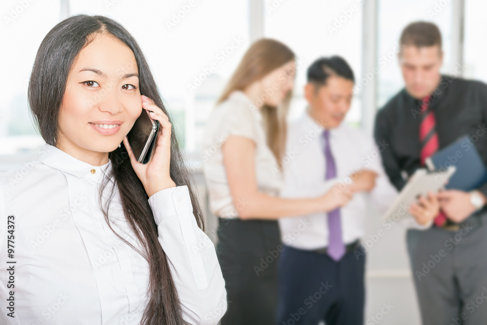 Successful asian business woman using mobile phone Successful asian business woman using mobile phone