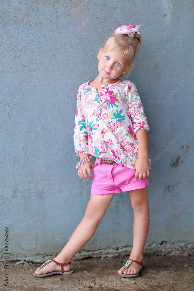portrait of little girl outdoors in summer
