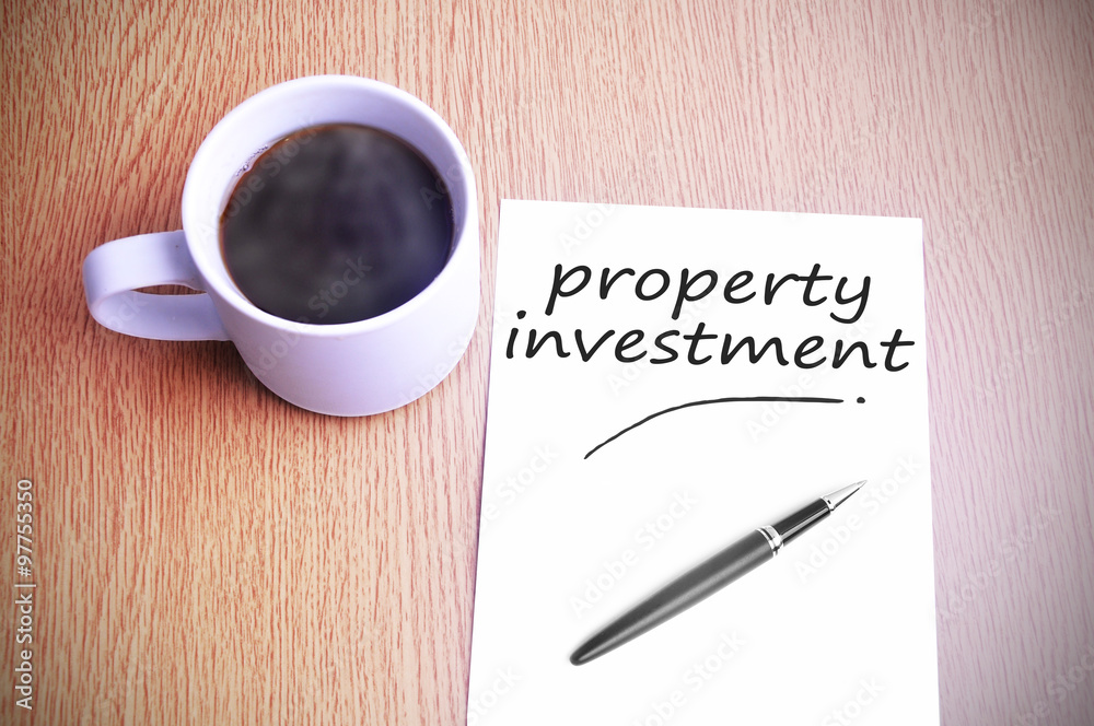 Coffee on the table with note writing property investment Coffee on the table with note writing property investment