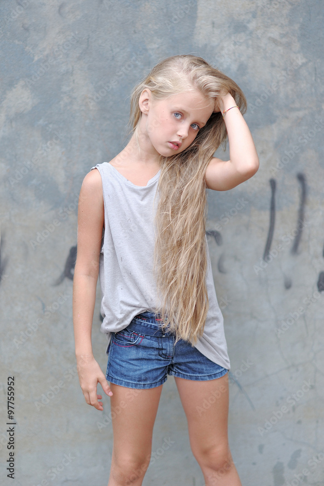portrait of little girl outdoors in summer
