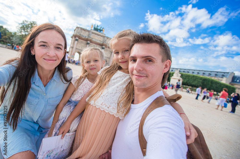 Happy family with two kids in Paris on summer vacation