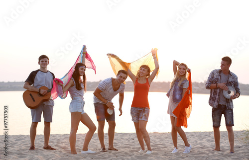 Carefree friends have fun on the beach