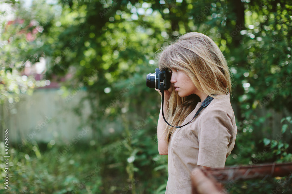 young beautiful girl with vintage camera