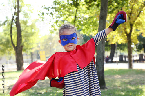 Cute little girl dressed as...