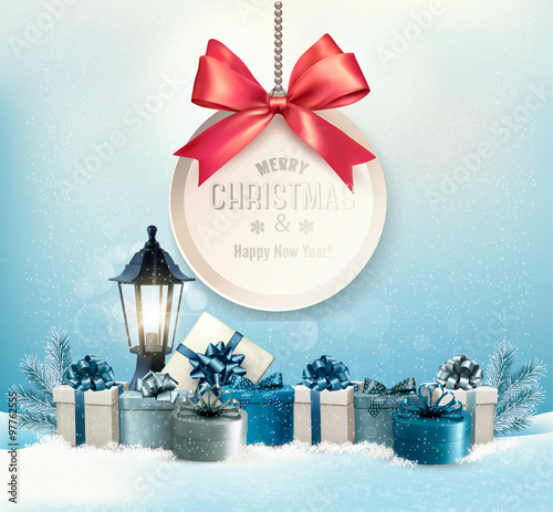 Merry Christmas card with a ribbon and gift boxes.