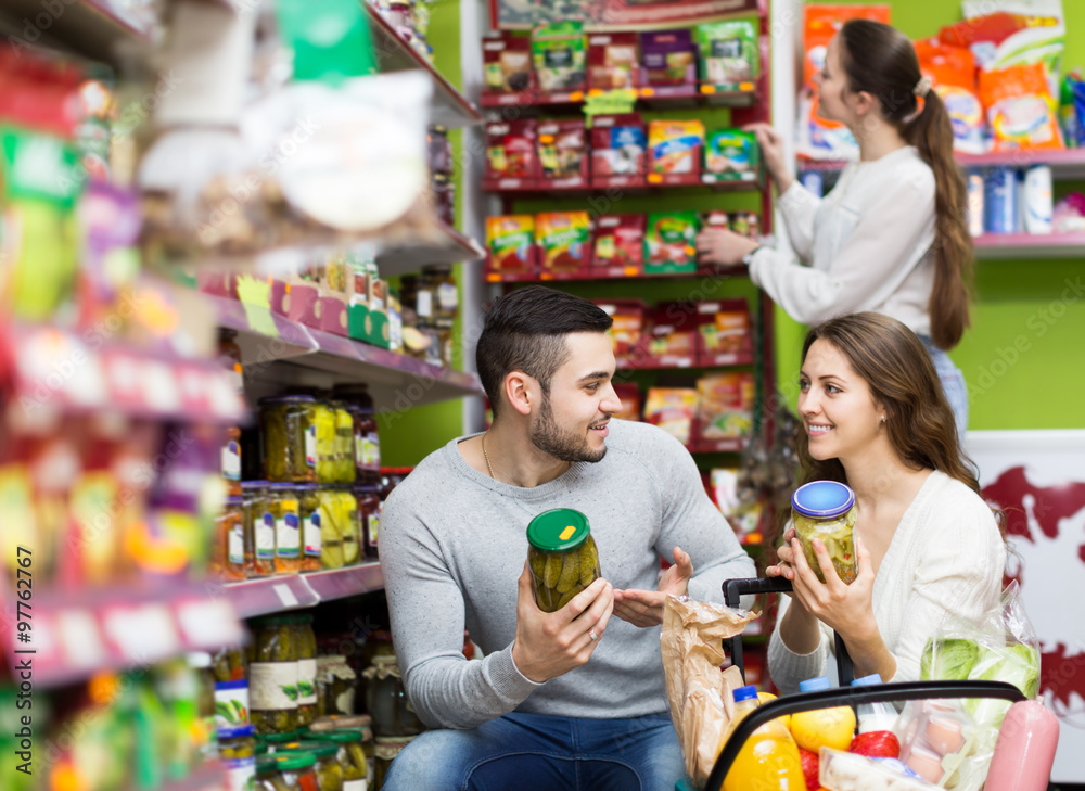 People purchasing food at supermarket