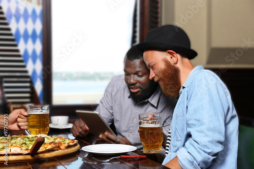 Young men drinking beer and...