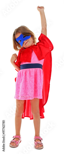 Superhero little girl poses...