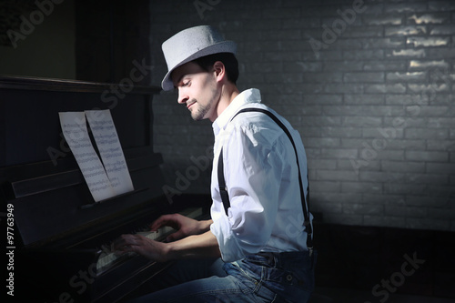 Handsome young man in hat m...