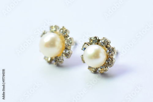 couple earrings on white background