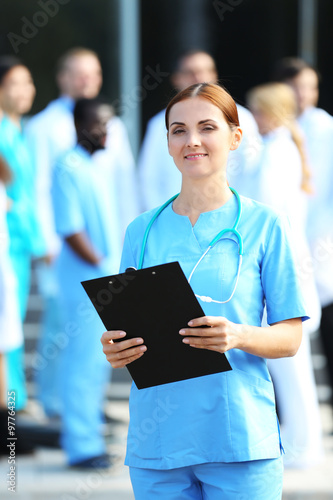 Portrait of woman doctor wi...