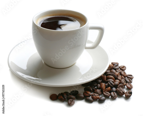 Fototapeta Naklejka Na Ścianę i Meble -  A cup of tasty drink and scattered coffee grains, isolated on white