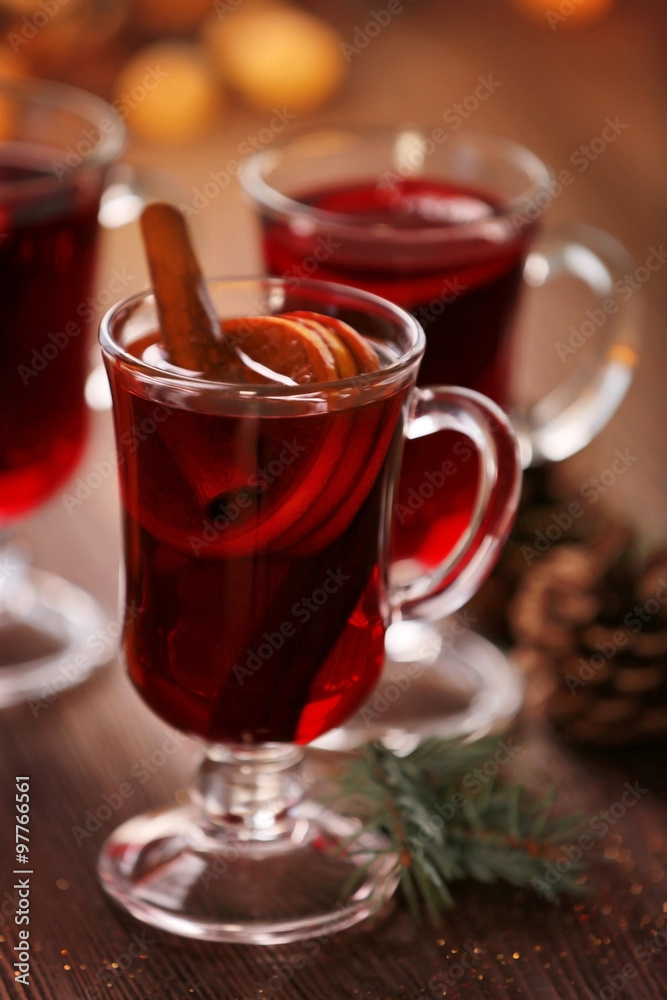 Mulled wine on wooden table, close-up Mulled wine on wooden table, close-up