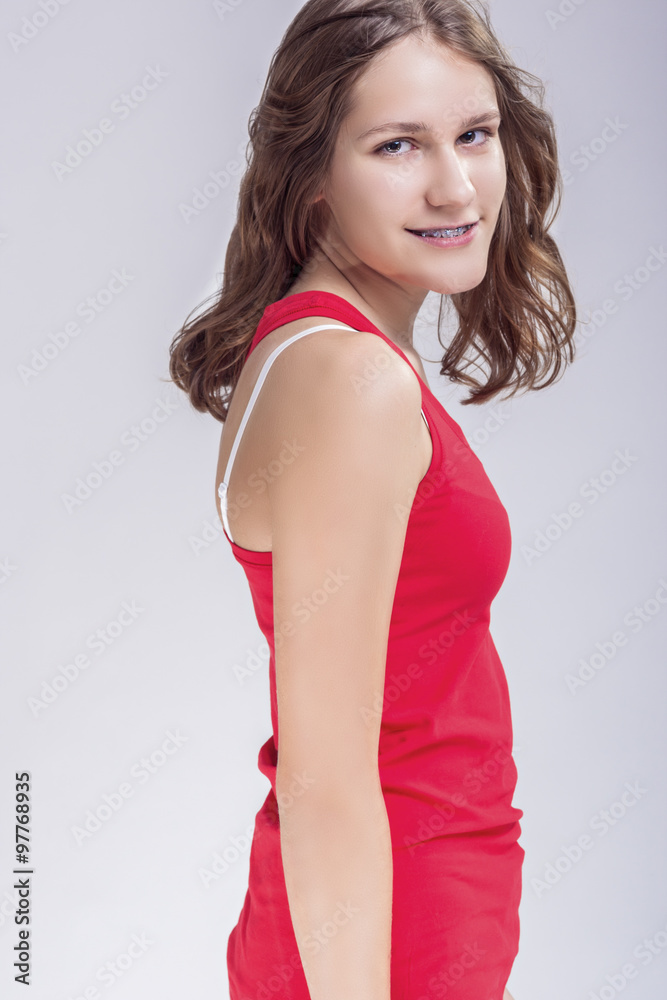 Dental Concept. Caucasian Young Blond Teenage Girl With Teeth Br Dental Concept. Caucasian Young Blond Teenage Girl With Teeth Br