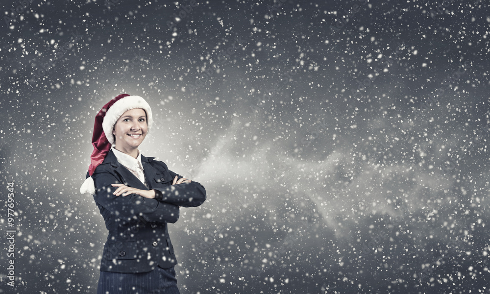 Naklejka premium Businesswoman in Santa hat