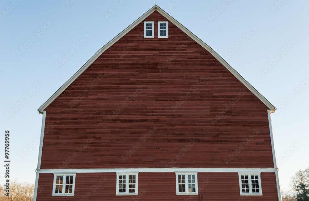 Unique red barn and blue sky on an old farm Unique red barn and blue sky on an old farm
