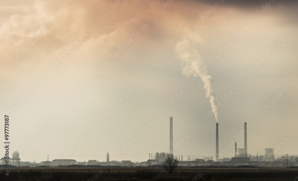 White smoke pollution coming from the stacks of a coal-powered plant White smoke pollution coming from the stacks of a coal-powered plant