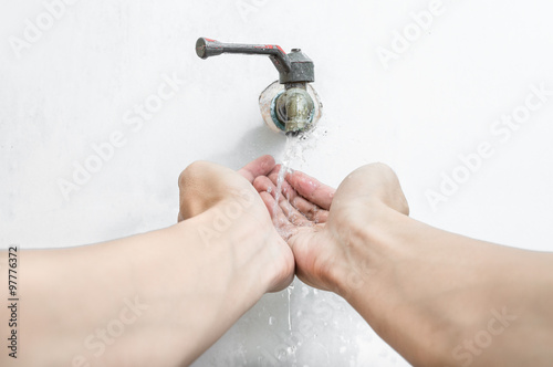 Hygiene. Cleaning Hands. Washing hands under flowing tap water.
