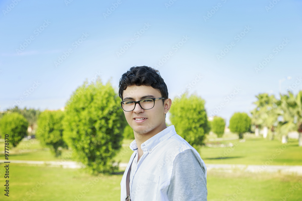 Close up portrait of a happy man standing outdoors with bag. Close up portrait of a happy man standing outdoors with bag.