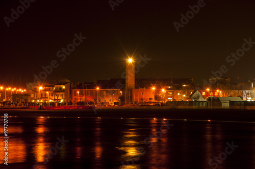 Lighthouse night in fano italy photo