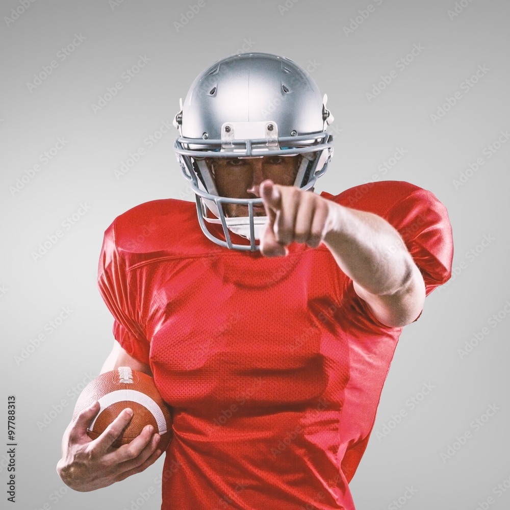 Composite image of portrait sports player in red jersey pointing Composite image of portrait sports player in red jersey pointing