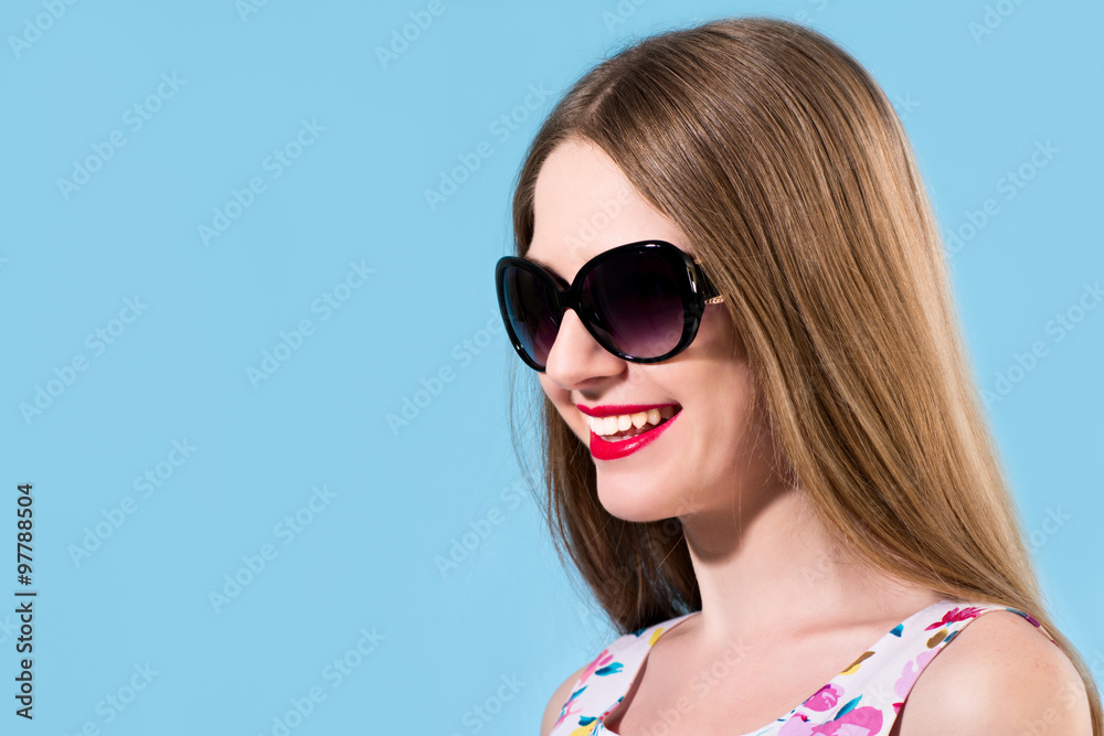 Beautiful smiling young woman with white teeth wearing sunglasse Beautiful smiling young woman with white teeth wearing sunglasse