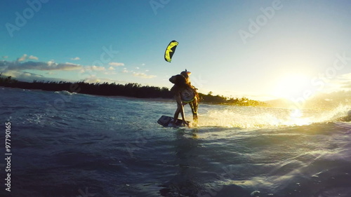Extreme Kitesurfing at Sunset. Summer Ocean Sport in Slow Motion. Girl Kite Surfing in Bikini 