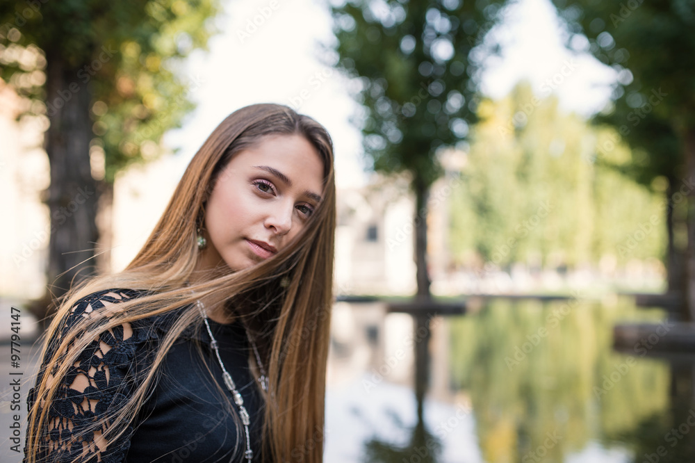 Close up portrait of young blonde woman outdoors. Parma, Italy. Close up portrait of young blonde woman outdoors. Parma, Italy.
