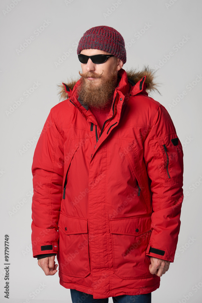 Man wearing red winter Alaska jacket with fur hood on Man wearing red winter Alaska jacket with fur hood on