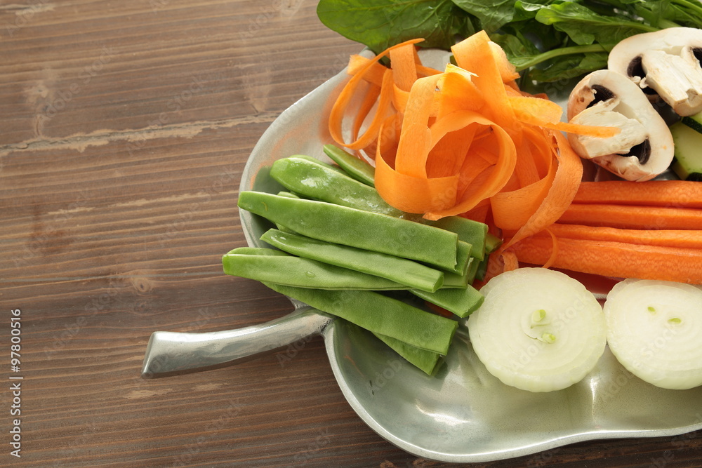 tray with fresh cut vegetables to cook
tray with fresh cut vegetables to cook
