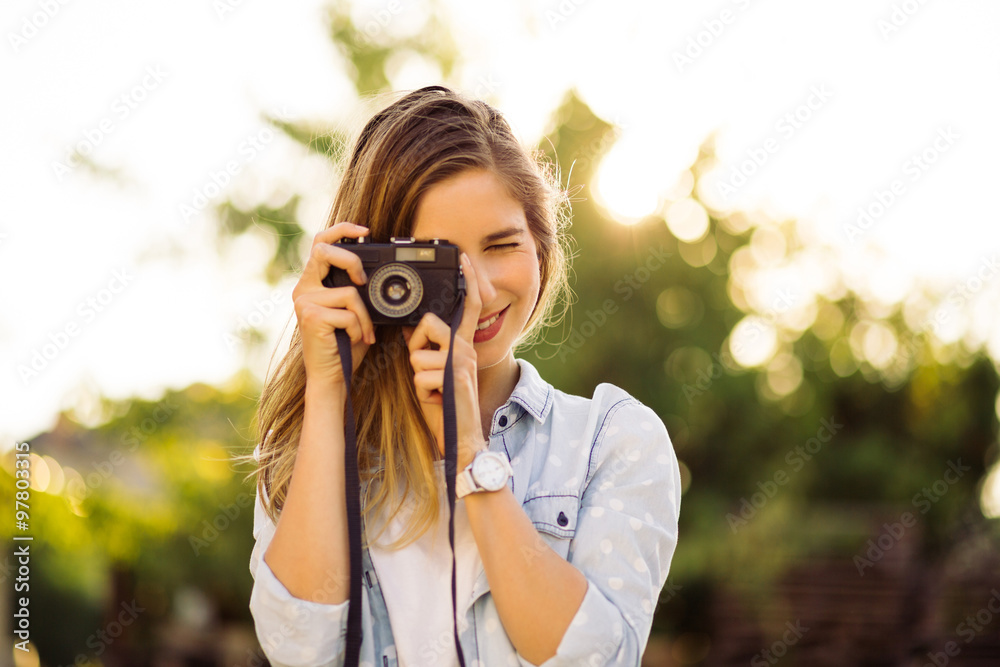 Hipster woman with retro film camera