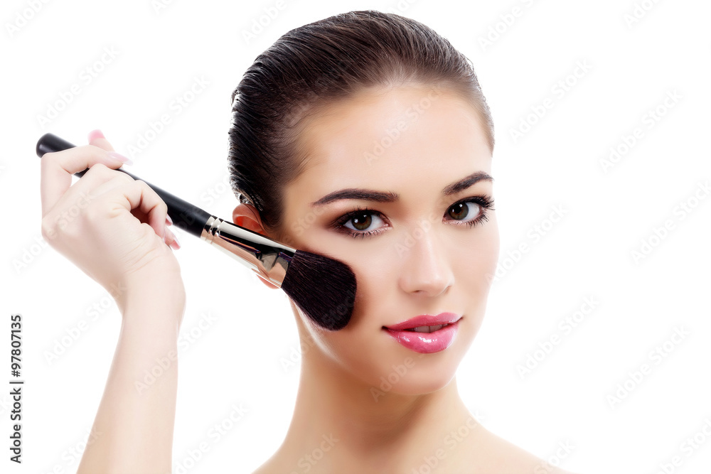 Pretty woman with makeup brush, isolated on white Pretty woman with makeup brush, isolated on white