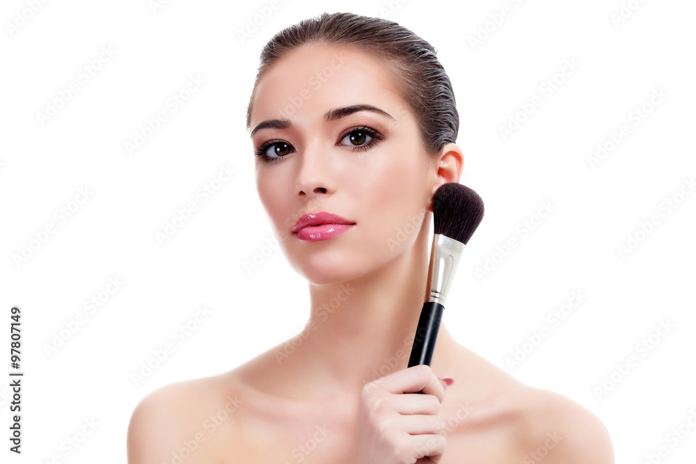 Pretty woman with makeup brush, isolated on white Pretty woman with makeup brush, isolated on white