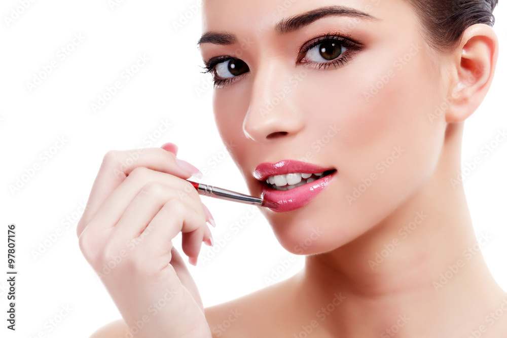 Pretty woman with makeup brush, isolated on white Pretty woman with makeup brush, isolated on white