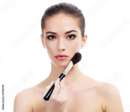 Pretty woman with makeup brush, isolated on white