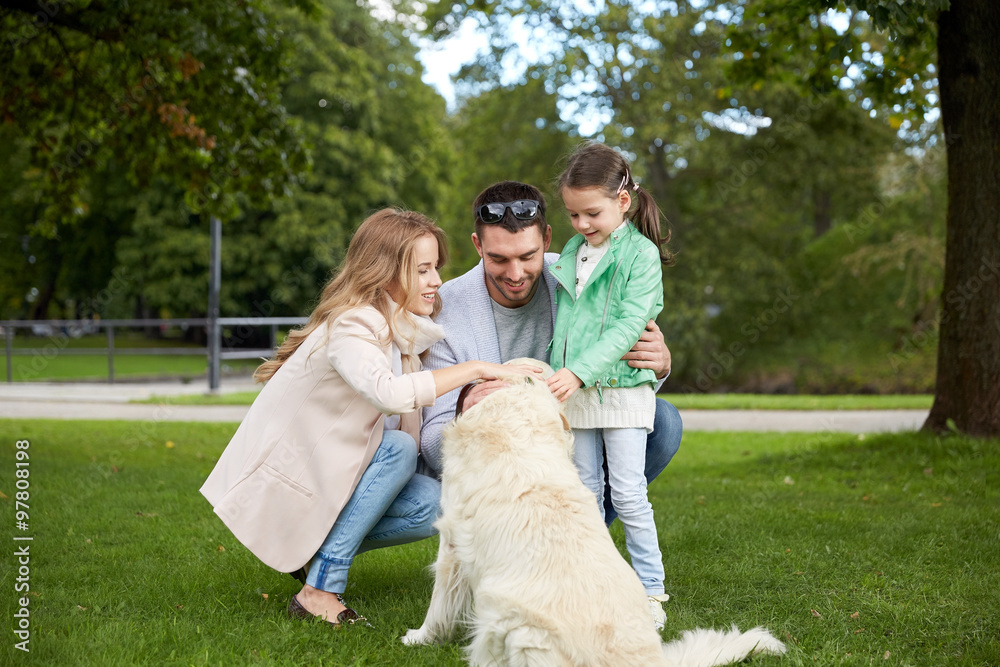 happy family with labrador retriever dog in park happy family with labrador retriever dog in park