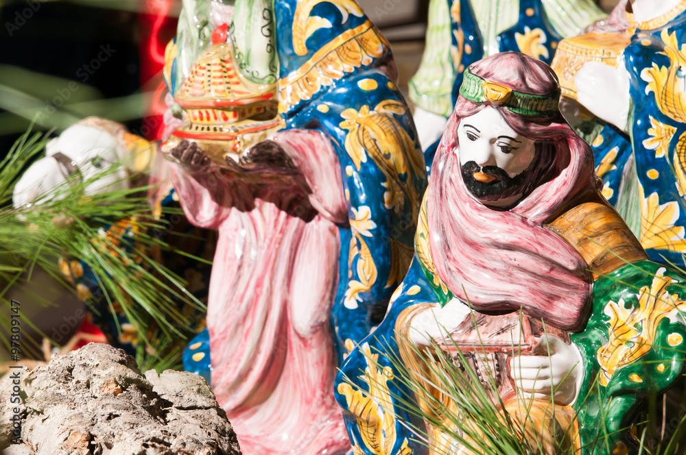 Fototapeta premium Painted pottery statue portraying one of the three wise men, work by a ceramic artisan in Caltagirone