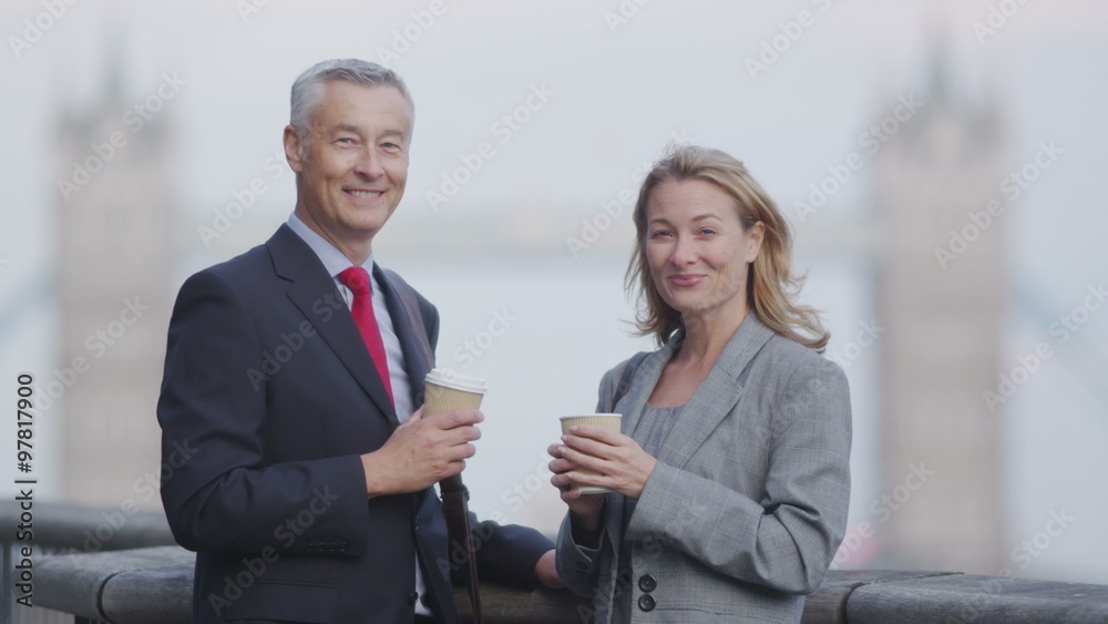 Two people talk whilst discussing business development ideas. Two people talk whilst discussing business development ideas.