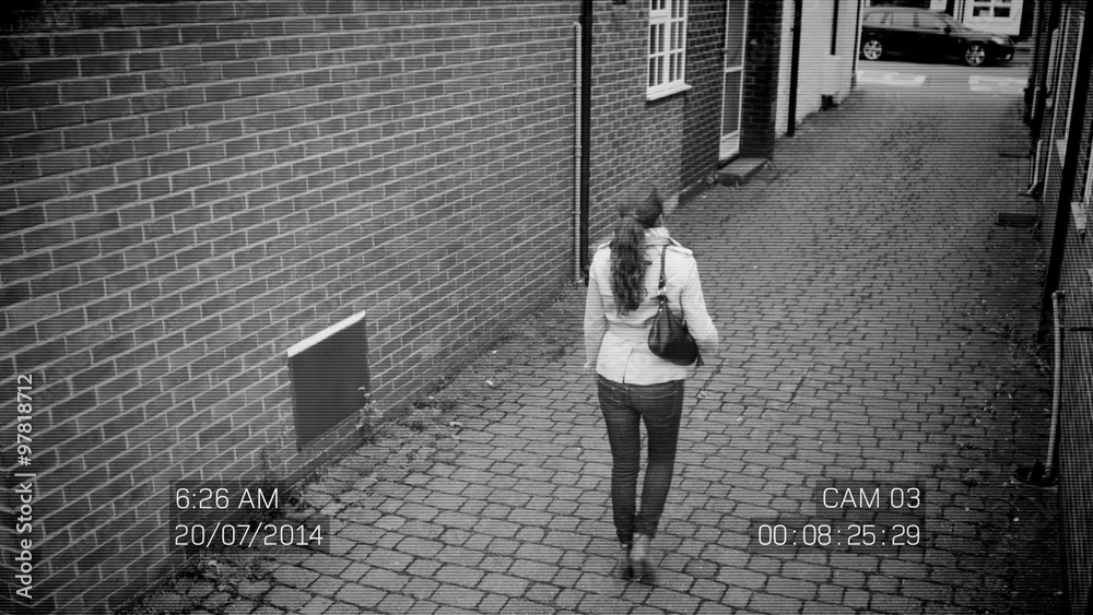  CCTV footage of woman in street being attacked by hooded thugs