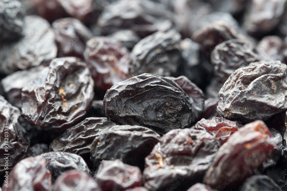 Black raisins as background. macro Black raisins as background. macro