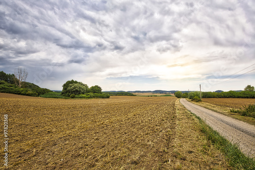 HDR landscape with fields and dramatic sky